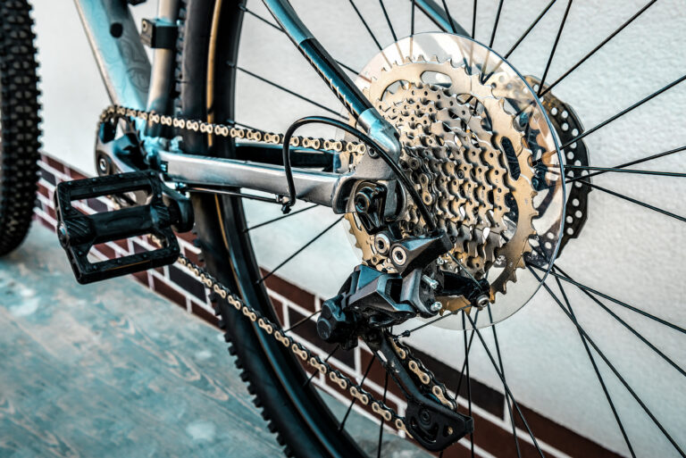 Shifting gears on rear transmission of bicycle. Rear derailleur, cassette and chain